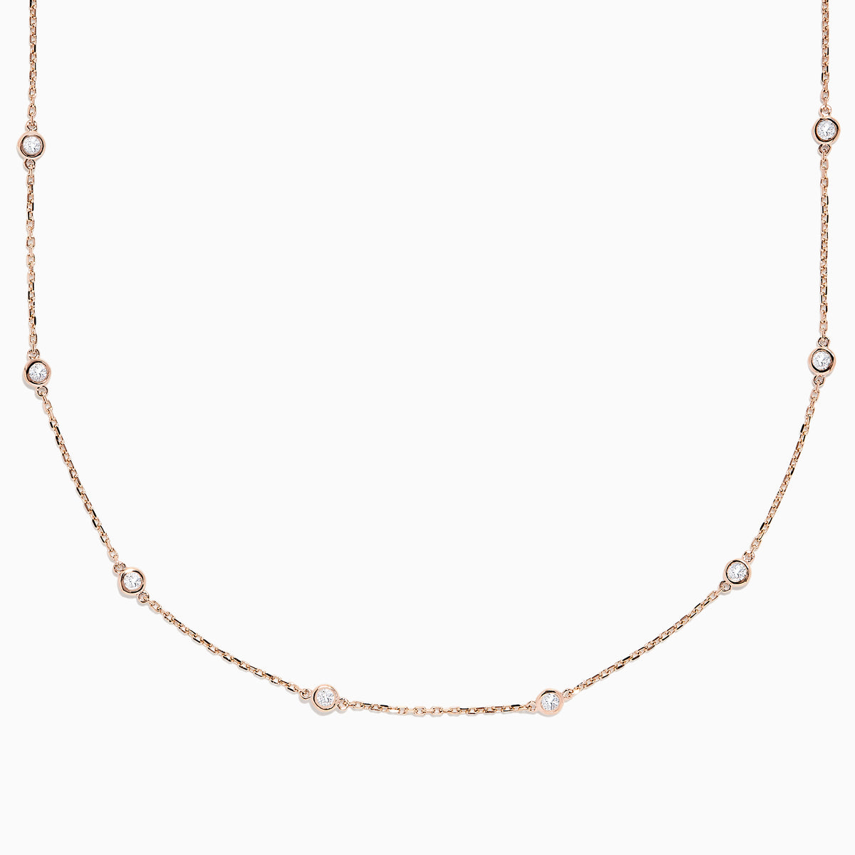 The 14K Rose Gold 18 Diamond Station Necklace features round bezel-set diamonds totaling 0.75 TCW, elegantly arranged and shown on a plain white background.