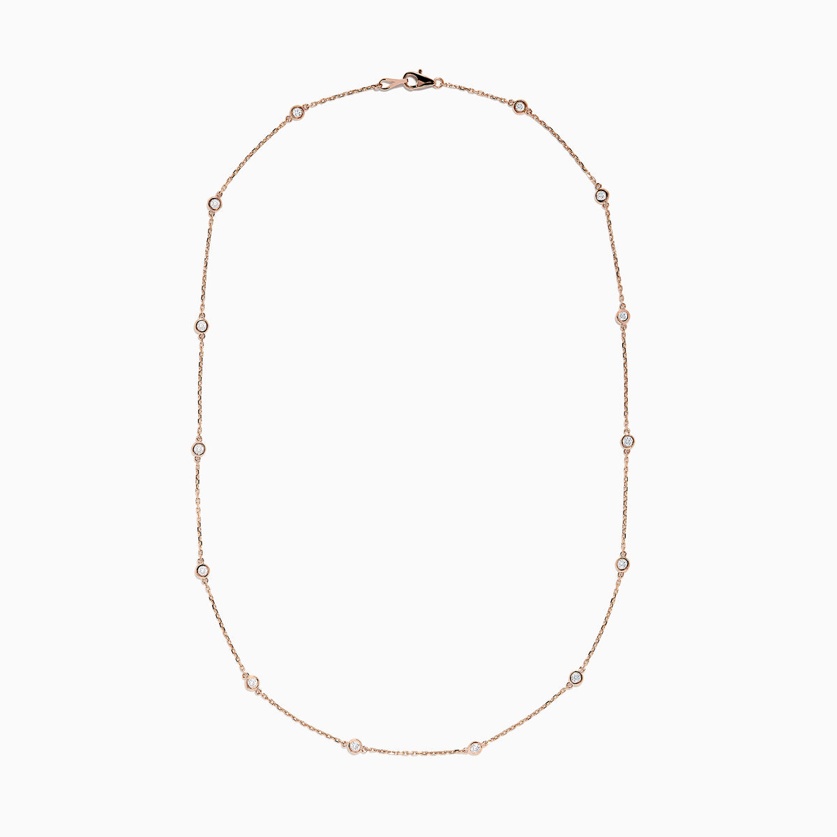 The 14K Rose Gold 18 Diamond Station Necklace features round bezel-set diamonds totaling 0.75 TCW, elegantly arranged and shown on a plain white background.
