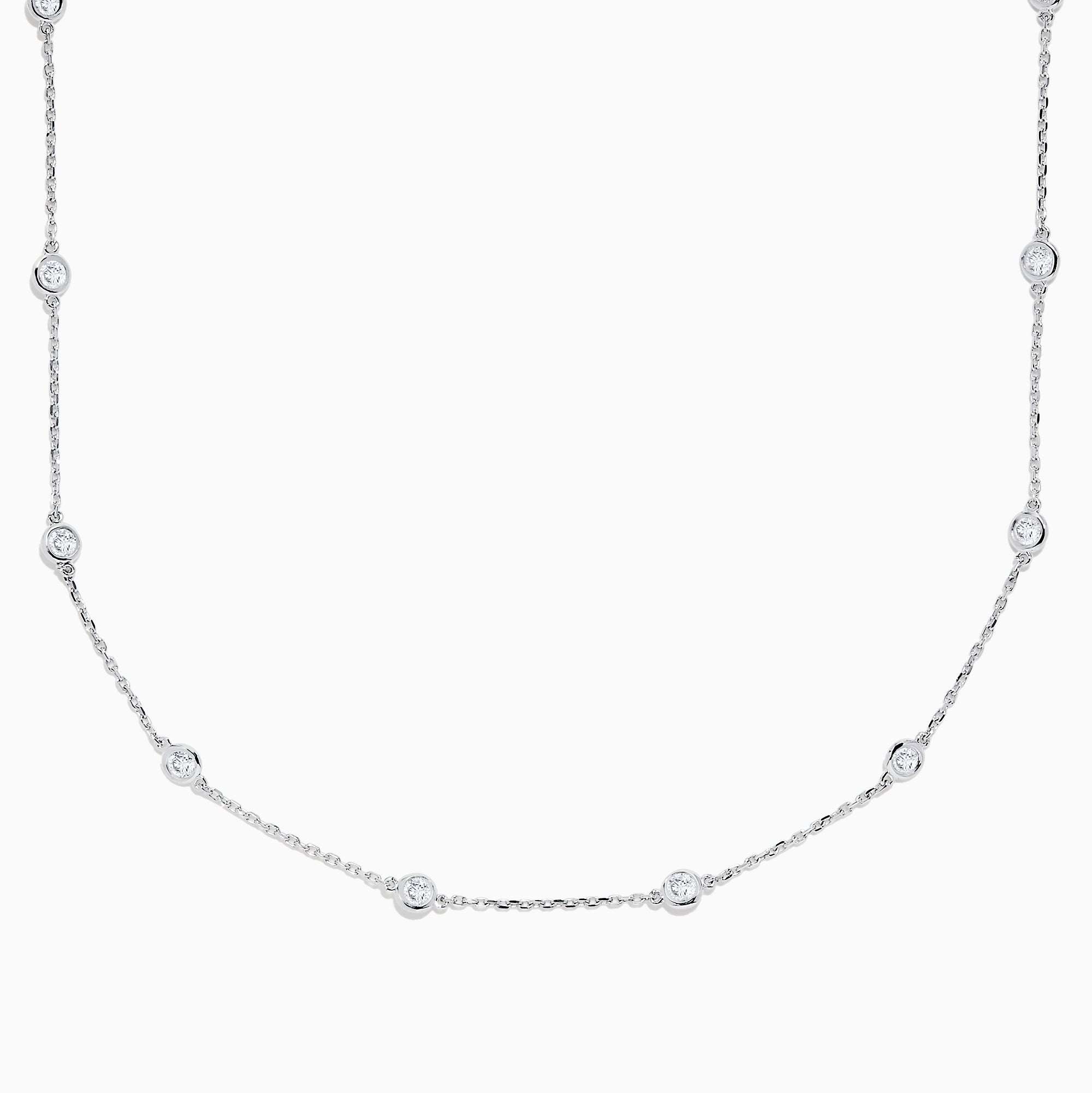 The 14K White Gold 18 Diamond Station Necklace boasts 1.50 TCW of round diamonds in bezel settings on a fine chain, shown against a white background.