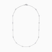 The 14K White Gold 18 Diamond Station Necklace boasts 1.50 TCW of round diamonds in bezel settings on a fine chain, shown against a white background.