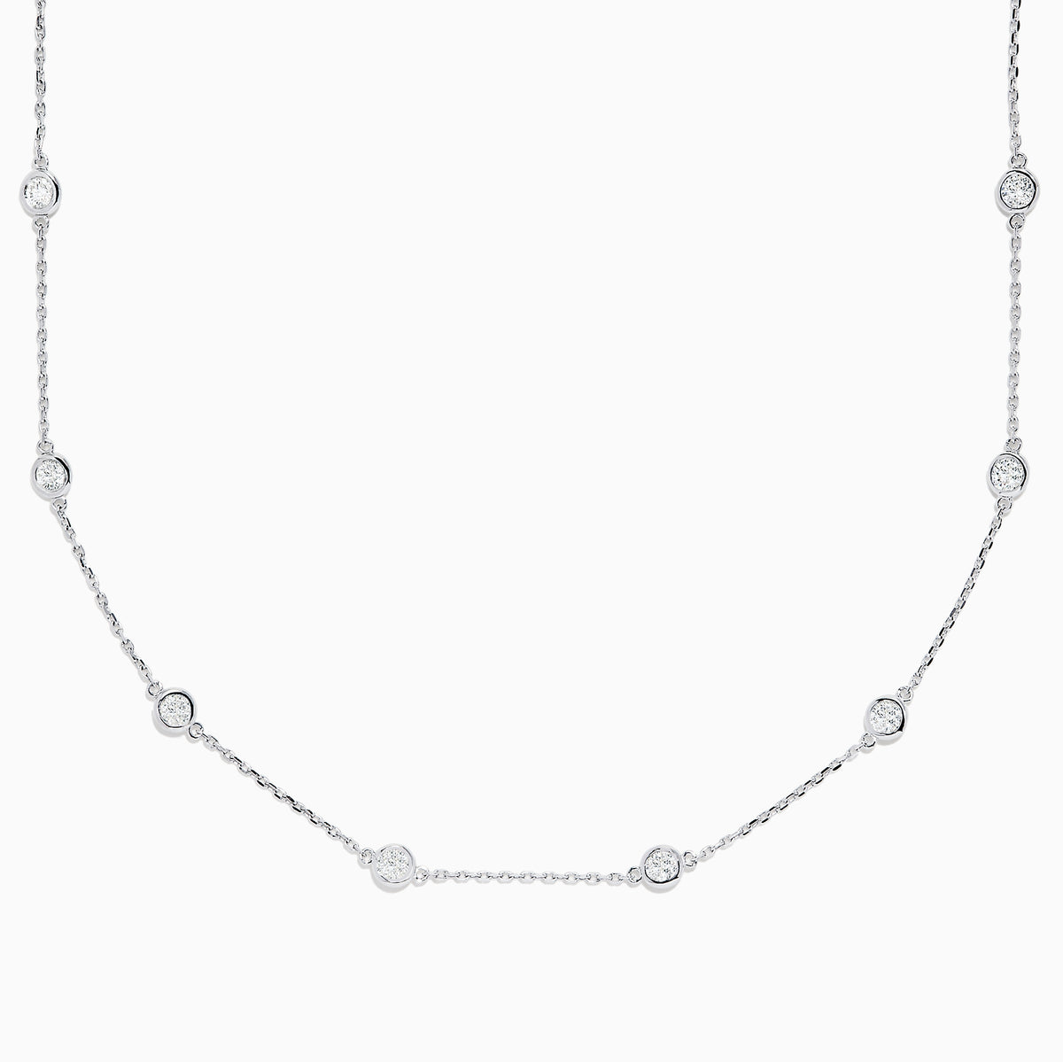 The 14K White Gold 18 Diamond Station Necklace features evenly spaced bezel-set round diamonds totaling 2.00 TCW, offering a simple, elegant, and minimalist design for timeless sophistication.