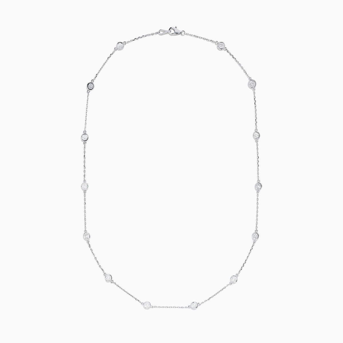 The 14K White Gold 18 Diamond Station Necklace features evenly spaced bezel-set round diamonds totaling 2.00 TCW, offering a simple, elegant, and minimalist design for timeless sophistication.