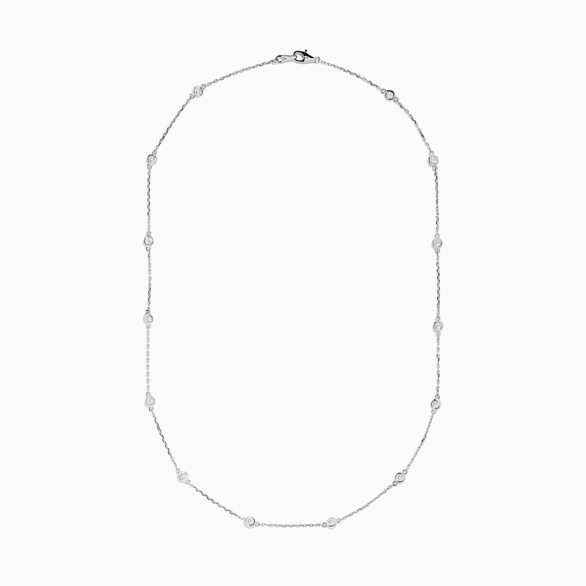 The 14K White Gold 18 Diamond Station Necklace showcases evenly spaced round bezel-set diamonds totaling 1.00 TCW, elegantly displayed against a white background.