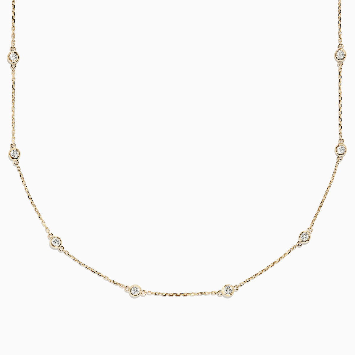 The 14K Yellow Gold 18 Diamond Station Necklace, 1.00 TCW, features small round bezel-set diamonds spaced along a delicate gold chain for an elegant, minimalist look.