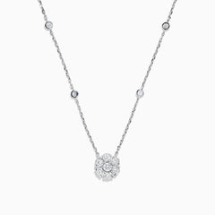 The 14K White Gold 18 Diamond Station and Flower Cluster Necklace (1.51 TCW) features a delicate flower cluster pendant and sparkling round diamonds along the chain, shown on a white background.