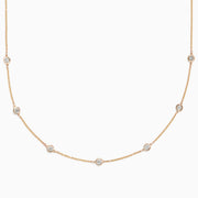 The DOro 14K Yellow Gold Diamond Station Necklace, 0.69 TCW, features a fine gold chain with evenly spaced bezel-set round diamonds for a delicate and elegant look.