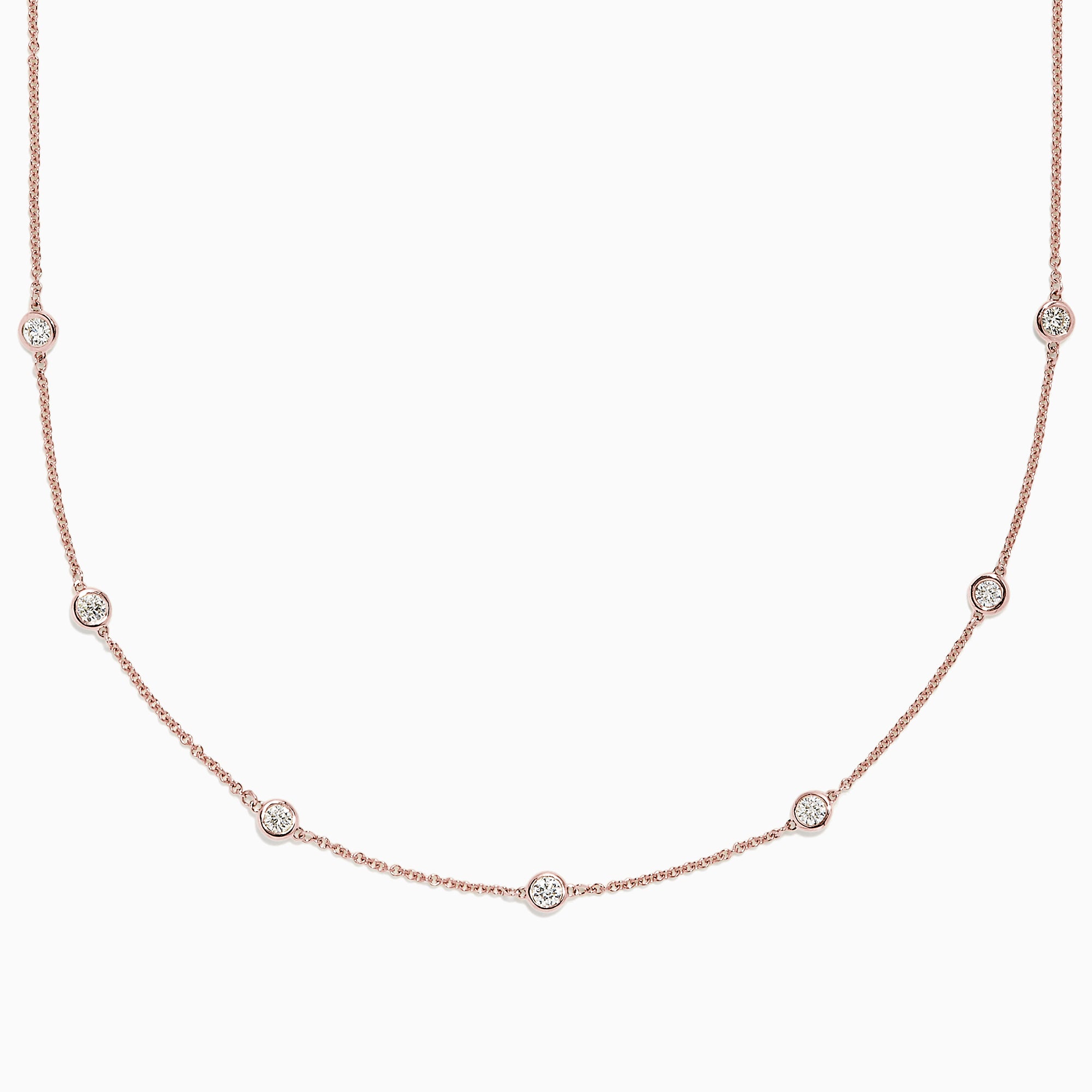 The Pave Rose 14K Rose Gold Diamond Station Necklace, 0.69 TCW, features round bezel-set diamonds spaced along a fine rose gold chain and is displayed on a plain white background.