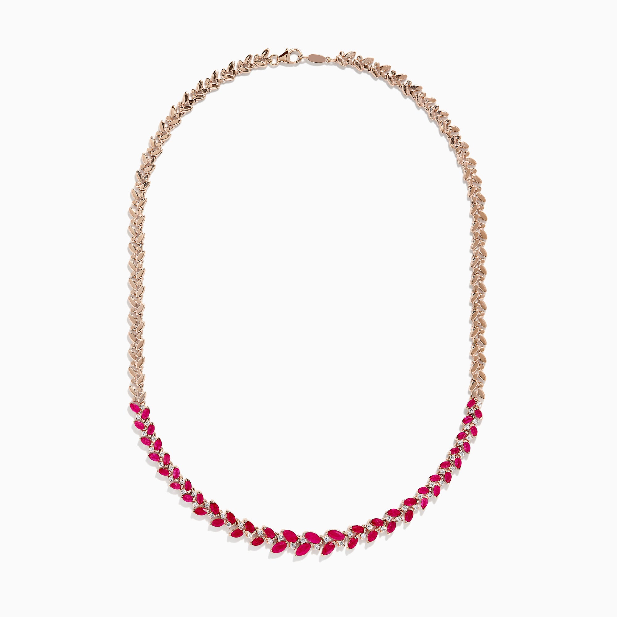 The Ruby Royale 14K Yellow Gold Ruby and Diamond Leaf Necklace showcases a leaf-inspired design with alternating rubies and diamonds in front, smoothly transitioning to a sleek yellow gold pattern at the back.