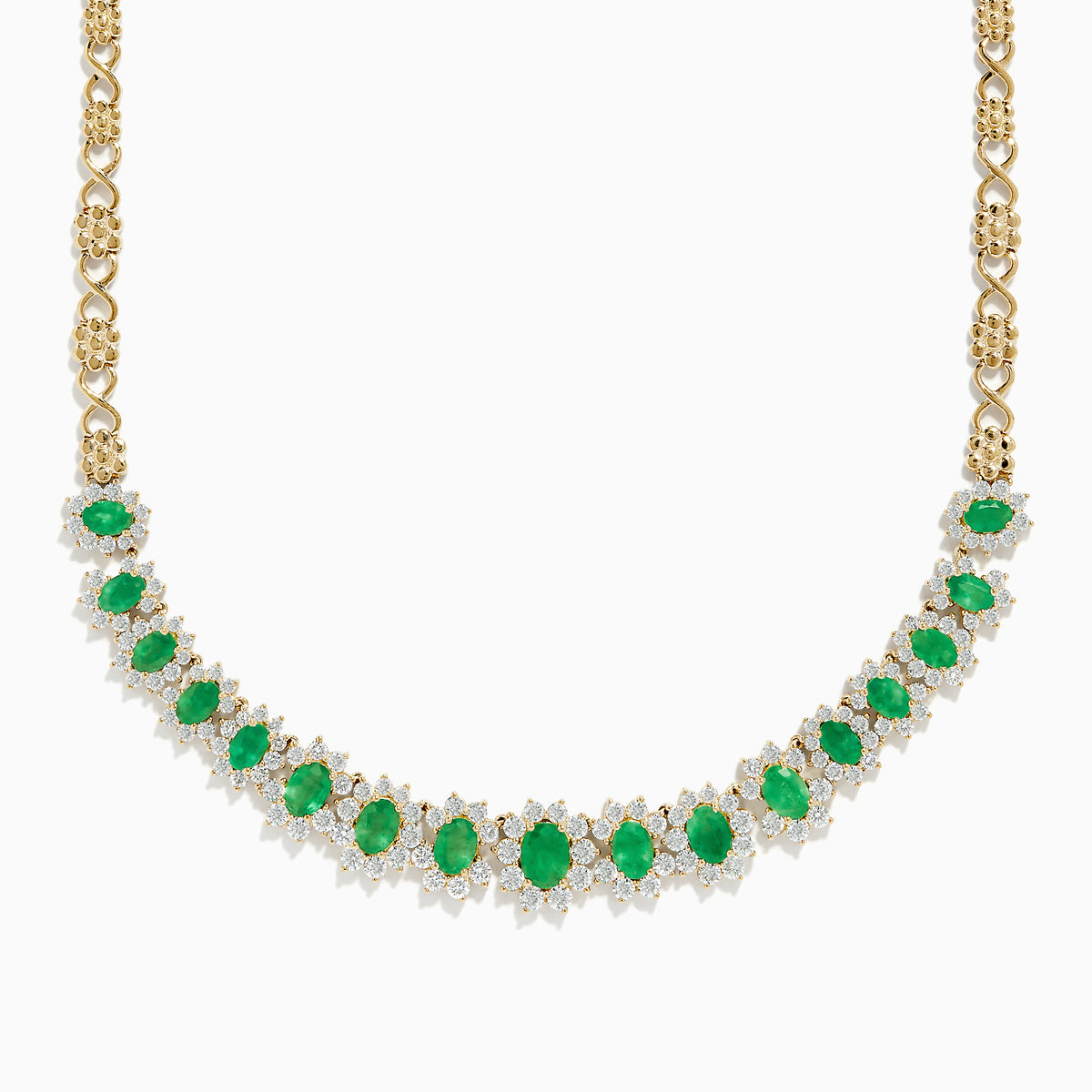 The Brasilica 14K Yellow Gold Emerald and Diamond Necklace features a row of oval emeralds, each accented by clusters of sparkling diamonds, set on an ornate yellow gold chain.