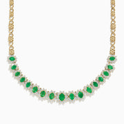 The Brasilica 14K Yellow Gold Emerald and Diamond Necklace features a row of oval emeralds, each accented by clusters of sparkling diamonds, set on an ornate yellow gold chain.