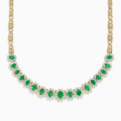 The Brasilica 14K Yellow Gold Emerald and Diamond Necklace features a row of oval emeralds, each accented by clusters of sparkling diamonds, set on an ornate yellow gold chain.
