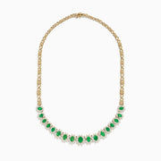 The Brasilica 14K Yellow Gold Emerald and Diamond Necklace features a row of oval emeralds, each accented by clusters of sparkling diamonds, set on an ornate yellow gold chain.