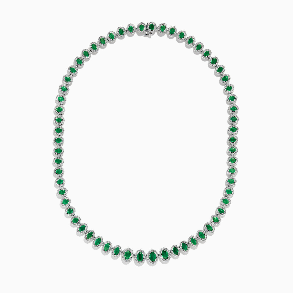 The 14K White Gold Emerald and Diamond Tennis Necklace showcases oval green emeralds, each surrounded by sparkling diamonds, evenly set along a white gold chain displayed on a white background.