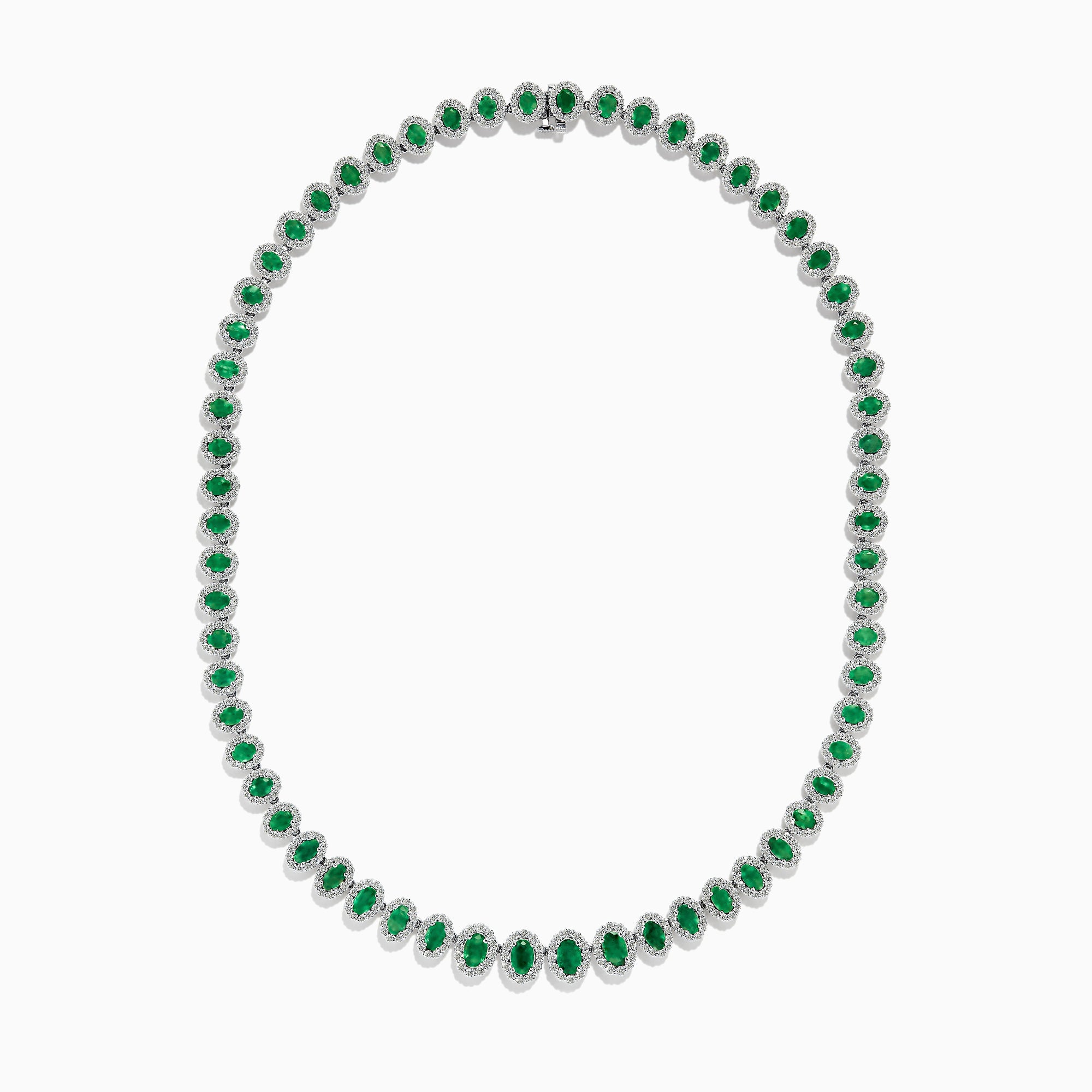 The 14K White Gold Emerald and Diamond Tennis Necklace showcases oval green emeralds, each surrounded by sparkling diamonds, evenly set along a white gold chain displayed on a white background.