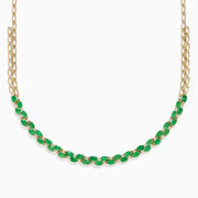A beautiful 14K yellow gold necklace with two chains, featuring a row of oval emeralds and diamonds along the front for a timeless, elegant look.