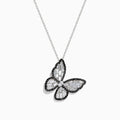The Nature 14K White Gold Black and White Diamond Butterfly Pendant dazzles with textured wings outlined in black stones, set on a sleek white gold chain for an elegant look.