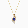 The Nahla Siri 14K Gold Tanzanite and Diamond Pendant, 1.46 TCW, features a swirling gold design with a triangular blue tanzanite center and a row of diamonds along one edge, shown against a white background.