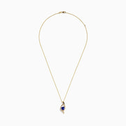 The Nahla Siri 14K Gold Tanzanite and Diamond Pendant, 1.46 TCW, features a swirling gold design with a triangular blue tanzanite center and a row of diamonds along one edge, shown against a white background.