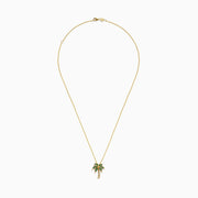 The Novelty 14K Yellow Gold Emerald and Diamond Palm Tree Pendant features emerald gemstone leaves and diamond-accented trunk, displayed on a plain white background.