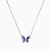 The Nahla Siri 14K White Gold Tanzanite and Diamond Butterfly Necklace (1.24 TCW) features a butterfly pendant with tanzanite-blue gemstone wings and diamond accents, shown against a white background.