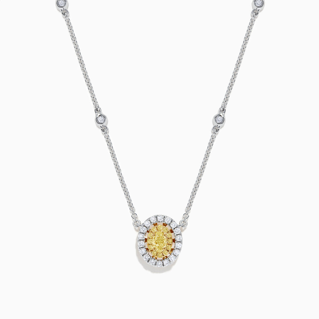 The Canare 14K White Gold Oval Halo Yellow Diamond Pendant Necklace, 0.81 TCW, features a central oval yellow diamond surrounded by clear stones on a silver chain for an elegant, radiant look.