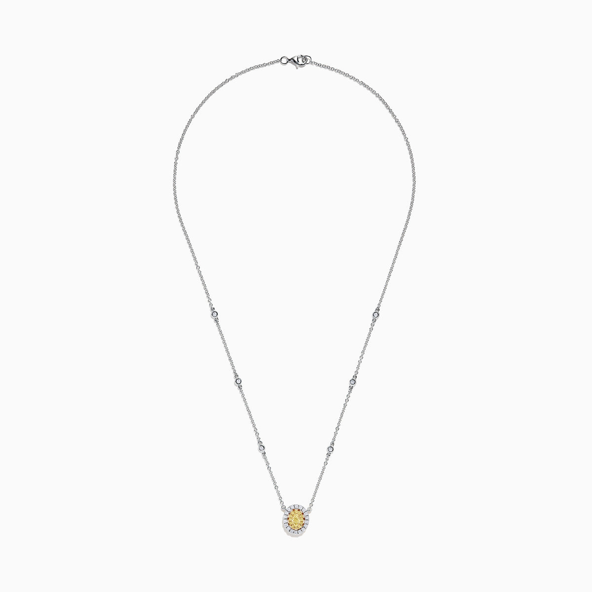 The Canare 14K White Gold Oval Halo Yellow Diamond Pendant Necklace, 0.81 TCW, features a central oval yellow diamond surrounded by clear stones on a silver chain for an elegant, radiant look.
