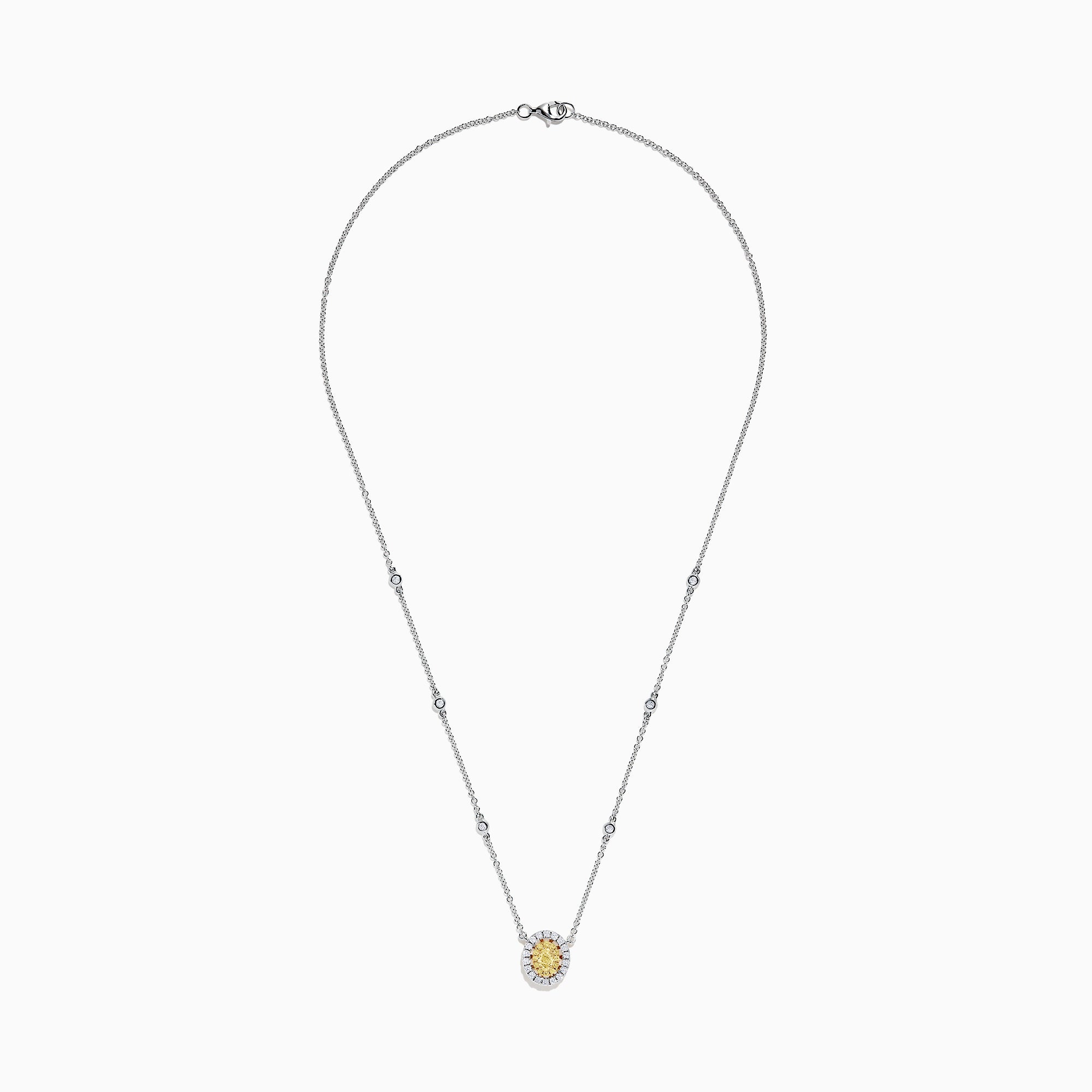 The Canare 14K White Gold Oval Halo Yellow Diamond Pendant Necklace, 0.81 TCW, features a central oval yellow diamond surrounded by clear stones on a silver chain for an elegant, radiant look.