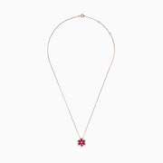 The Nature 14K Rose Gold Ruby and Diamond Flower Necklace (1.91 TCW) features a flower pendant with six ruby petals, each outlined by sparkling diamonds.