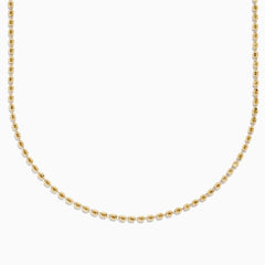 The 14K Yellow Gold Bead Necklace features evenly spaced, small spherical beads on a delicate chain, shown against a white background for a simple, elegant look.