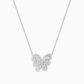 The 14K White Gold Diamond Butterfly Necklace features a butterfly-shaped pendant adorned with sparkling diamonds, elegantly suspended from a fine chain for a delicate, symmetrical look.