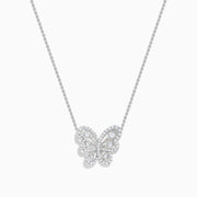 The 14K White Gold Diamond Butterfly Necklace features a butterfly-shaped pendant adorned with sparkling diamonds, elegantly suspended from a fine chain for a delicate, symmetrical look.