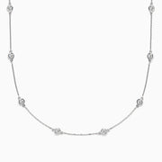 The Pave Classica 14K White Gold Diamond Station Necklace, 1.50 TCW, features small round bezel-set diamonds evenly spaced along a fine chain and is displayed against a white background.