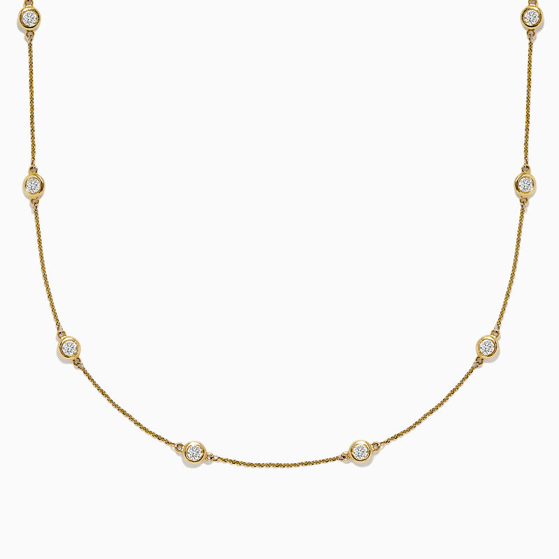 The D’Oro 14K Yellow Gold Diamond Station Necklace features evenly spaced bezel-set diamonds totaling 1.50 TCW, each set in a small gold frame along the chain, displayed on a plain white background.