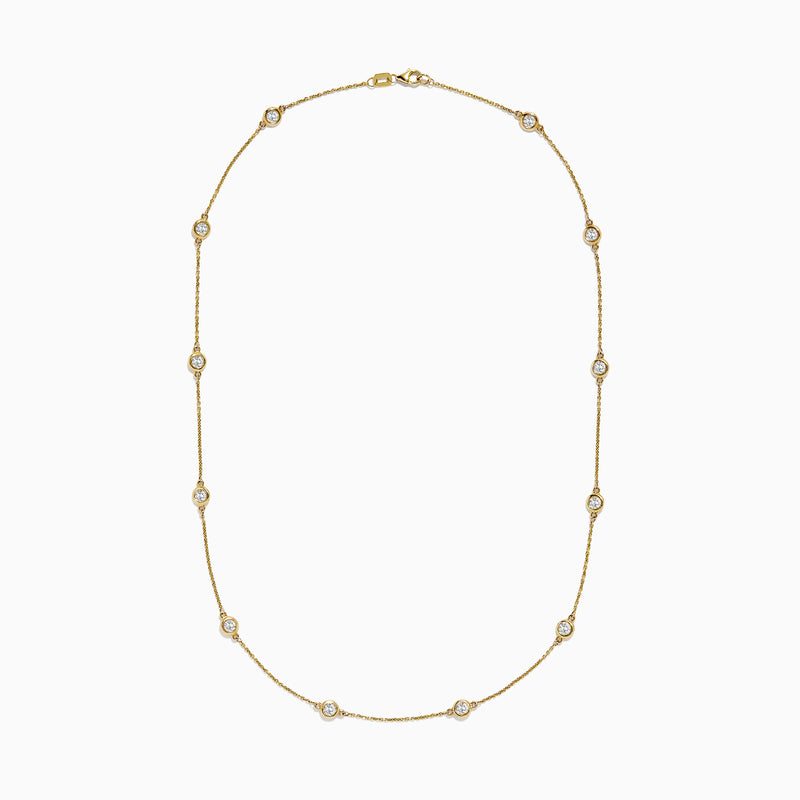 The D’Oro 14K Yellow Gold Diamond Station Necklace features evenly spaced bezel-set diamonds totaling 1.50 TCW, each set in a small gold frame along the chain, displayed on a plain white background.