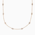 The Pave Rose 14K Rose Gold Diamond Station Necklace 1.50 TCW features evenly spaced round bezel-set diamonds on a rose gold chain, offering timeless elegance and sparkle to any outfit.