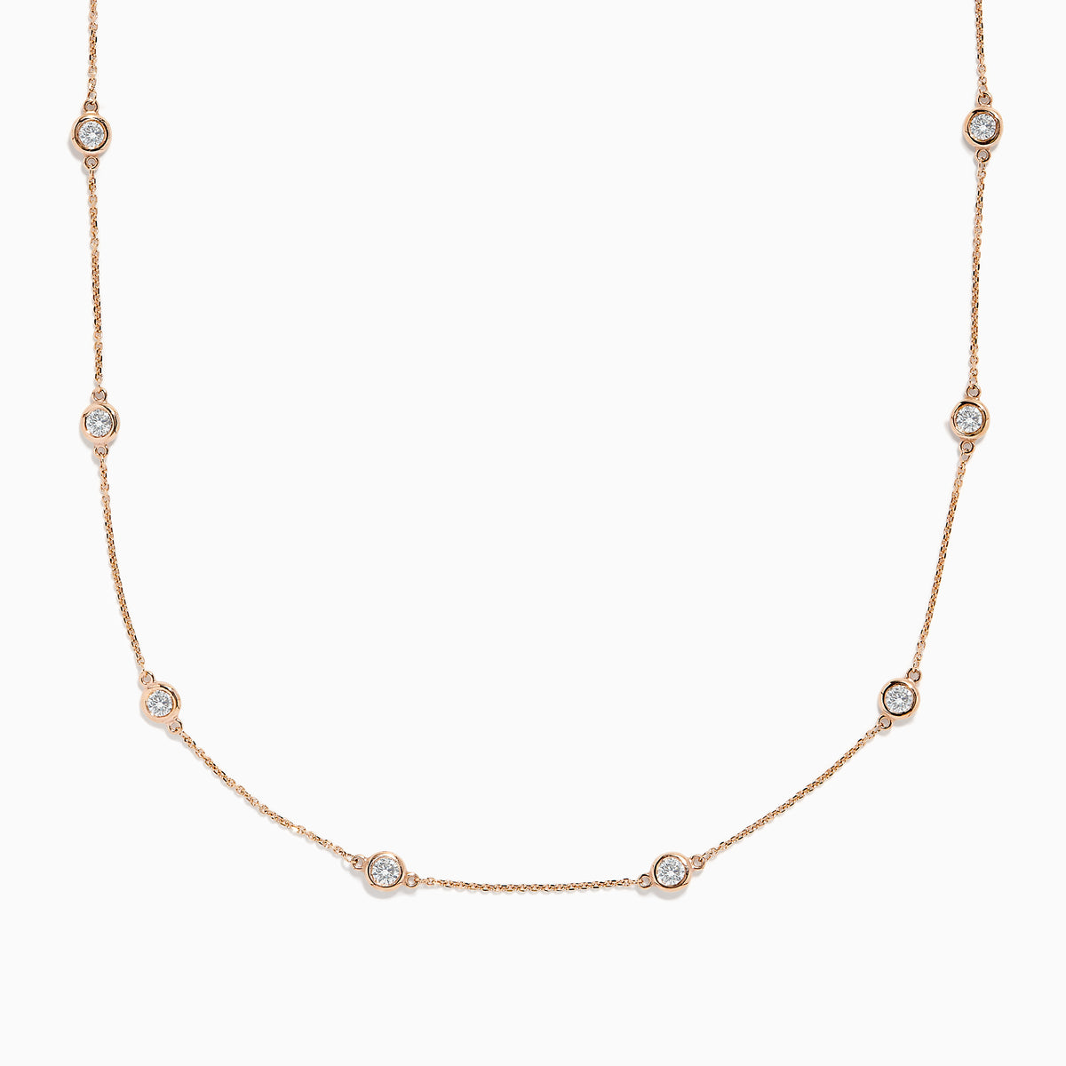 The Pave Rose 14K Rose Gold Diamond Station Necklace 1.50 TCW features evenly spaced round bezel-set diamonds on a rose gold chain, offering timeless elegance and sparkle to any outfit.
