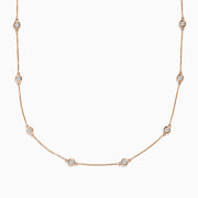 The Pave Rose 14K Rose Gold Diamond Station Necklace 1.50 TCW features evenly spaced round bezel-set diamonds on a rose gold chain, offering timeless elegance and sparkle to any outfit.