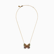 The Watercolors 14K Gold Ruby and Multi Sapphire Butterfly Pendant, adorned with vibrant green, pink, blue, black, and yellow gemstones, is displayed against a white background.
