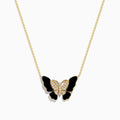 The Nature 14K Yellow Gold Onyx and Diamond Butterfly Necklace features a butterfly pendant with black onyx enamel wings, a body adorned with sparkling white crystals, and a delicate gold chain for an elegant, symmetrical look.