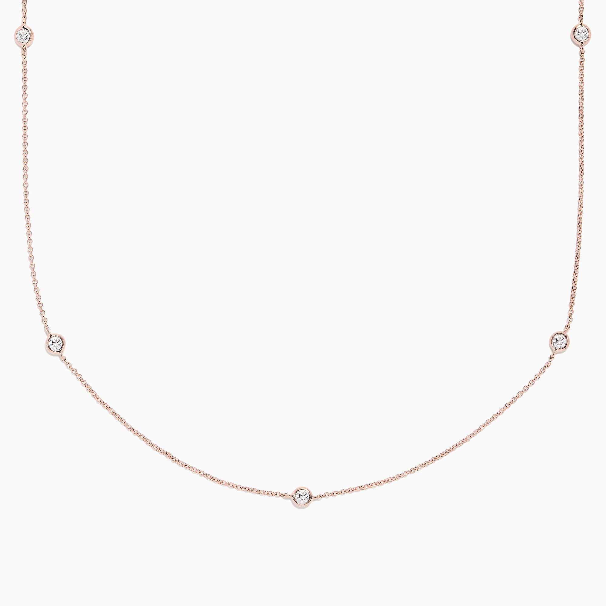The Pave Rose 14K Rose Gold Diamond Station Necklace (0.62 TCW) features delicately bezel-set round diamonds, offering a minimal and elegant look against a plain white background.