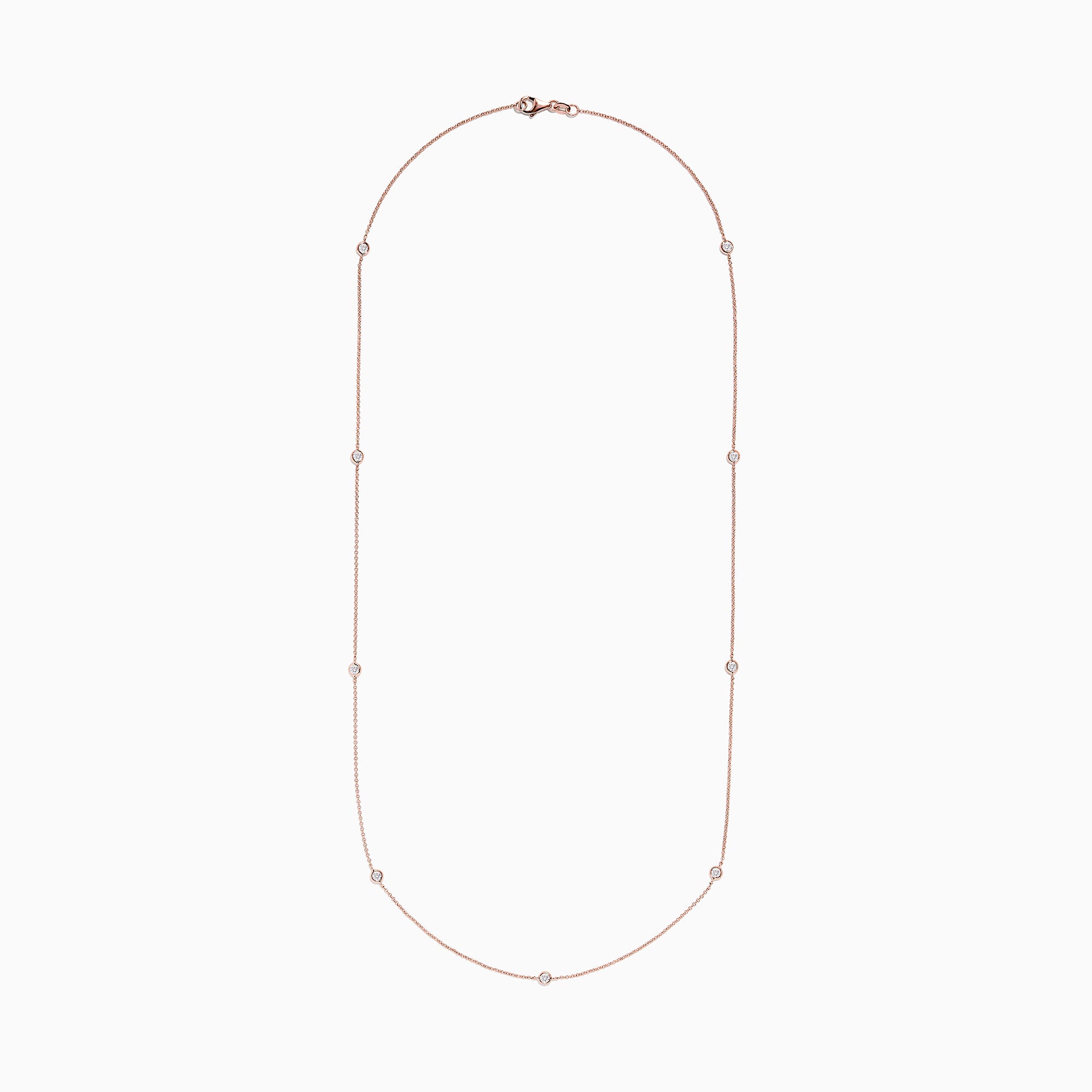 The Pave Rose 14K Rose Gold Diamond Station Necklace (0.62 TCW) features delicately bezel-set round diamonds, offering a minimal and elegant look against a plain white background.