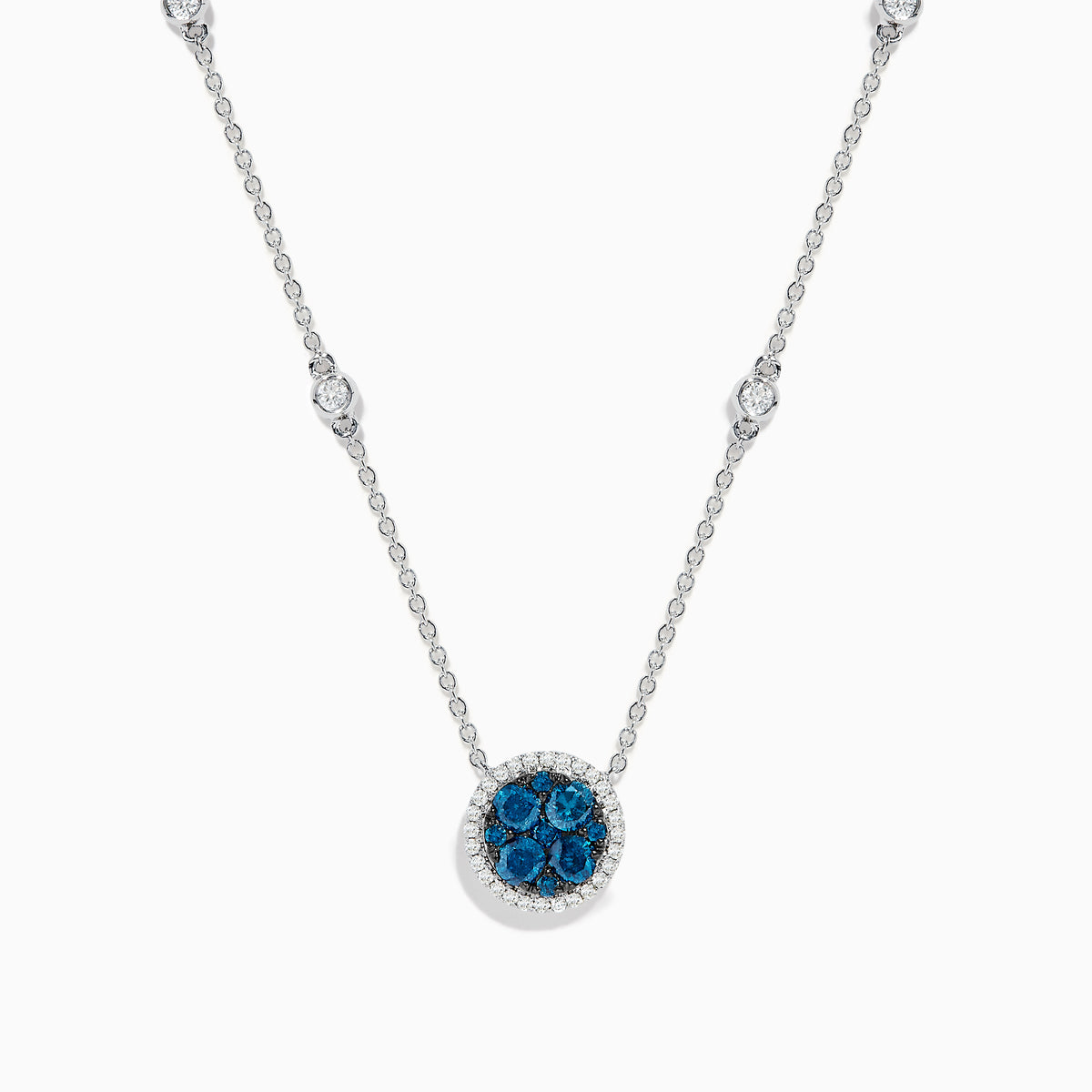 The Bella Bleu 14K White Gold White and Blue Diamond Stationary Necklace features a circular pendant with clustered blue diamonds surrounded by white diamonds, and a chain accented with additional sparkling white diamonds.
