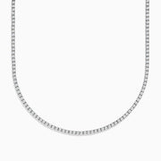 The Pave Classica 14K White Gold Diamond Tennis Necklace 10.51 TCW features small, round diamonds set closely in a continuous line, creating an elegant U-shape on a plain white background.