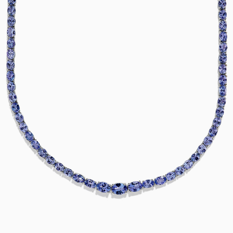 A close-up of the Nahla Siri Sterling Silver Tanzanite Necklace, 27.69 TCW, showcasing a continuous strand of round, faceted blue tanzanite gemstones set symmetrically against a white background.
