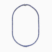 A close-up of the Nahla Siri Sterling Silver Tanzanite Necklace, 27.69 TCW, showcasing a continuous strand of round, faceted blue tanzanite gemstones set symmetrically against a white background.