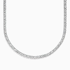 A close-up of the 925 Sterling Silver Diamond Tennis Necklace showcases its continuous row of sparkling round diamonds in a simple, elegant design against a white background.