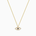 The Novelty 14K Yellow Gold Sapphire and Diamond Evil Eye Pendant features an eye-shaped design with sparkling stones and a central sapphire, resembling a classic talisman necklace.