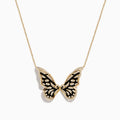 The Nature 14K Yellow Gold Diamond Butterfly Necklace showcases a butterfly pendant with black enamel wings and sparkling white stones, set against a plain white background.