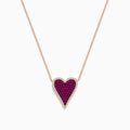 The Ruby Royale 14K Rose Gold Pave Ruby Heart Pendant Necklace features a heart-shaped pendant adorned with pave rubies and bordered by clear stones, set in an elegant rose gold setting.