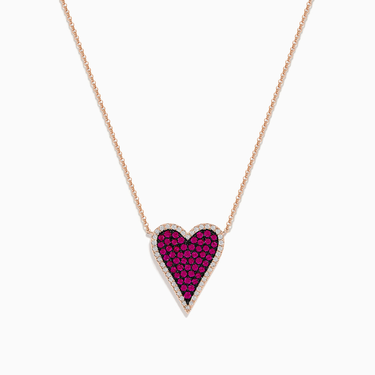 The Ruby Royale 14K Rose Gold Pave Ruby Heart Pendant Necklace features a heart-shaped pendant adorned with pave rubies and bordered by clear stones, set in an elegant rose gold setting.